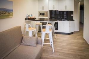 A kitchen or kitchenette at Apartamentos turisticos HAZ AMIGO
