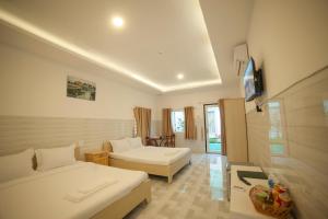 TV a/nebo společenská místnost v ubytování FaMi Nguyễn Homestay Châu Đốc