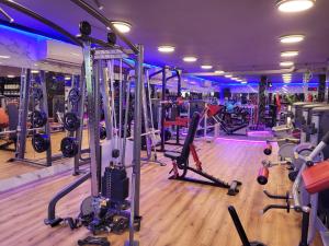 a gym with a bunch of machines in it at Milano Suite in Lev Eilat in Eilat