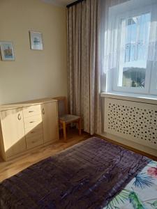 Postel nebo postele na pokoji v ubytování Apartamenty na skarpie