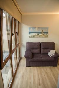 A seating area at Apartamentos turisticos HAZ AMIGO
