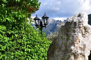 a street light next to a large rock at Appartments Helvetia in Villabassa