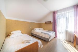 Posteľ alebo postele v izbe v ubytovaní Willa Zefirek