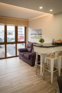A seating area at Apartamentos turisticos HAZ AMIGO