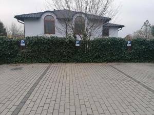 a house with handicapped signs in front of a driveway at penzion LILIE in Litomyšl