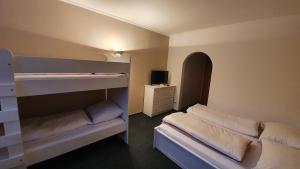Rúm í herbergi á Hotel PlannerInn