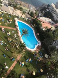 Bazén v ubytování Apartamento Torre de la Roca Torremolinos nebo v jeho okolí