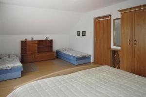 Holiday flat, Lubin tesisinde bir odada yatak veya yataklar