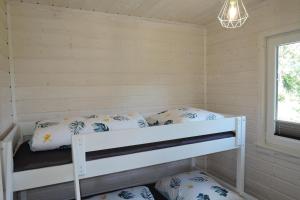 Tempat tidur dalam kamar di holiday home, Kolczewo
