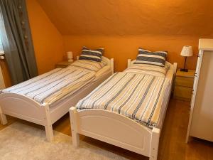 Postel nebo postele na pokoji v ubytování Gästezimmer Adenau