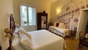 Postel nebo postele na pokoji v ubytování B&B I sei volti Lecce