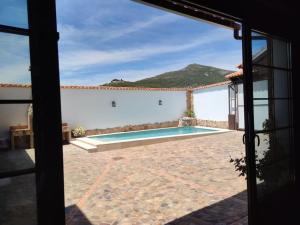 a view of a swimming pool from a house at LA CASA DE ELENA in Villarrubia de los Ojos