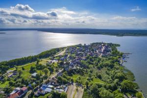 an aerial view of a small island in the water at Holiday home for 10 Person in Nowe Warpno in Nowe Warpno