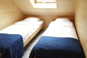 A bed or beds in a room at Holiday complex, Sarbinowo