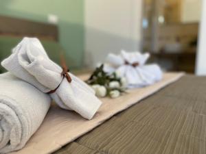 A bed or beds in a room at Porta alla Croce Guest House