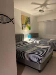 Postel nebo postele na pokoji v ubytování RESORT PLAYA AZUL 2 dormitorios