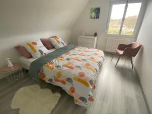 Au paradis d’Alsace 55 m2 nature & relax tesisinde bir odada yatak veya yataklar