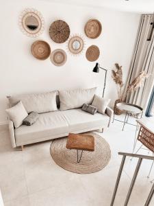 a living room with a couch and a table at AMORZELAS in Dębki