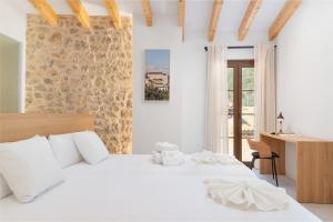 Llit o llits en una habitació de Placeta Vella Turismo de Interior