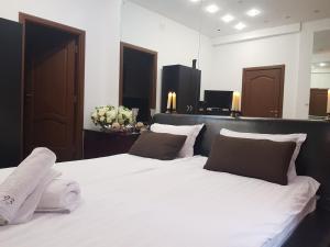 Tempat tidur dalam kamar di Ground Floor Mega Mall National Arena Monza