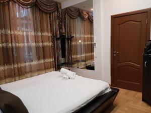 Ένα ή περισσότερα κρεβάτια σε δωμάτιο στο Ground Floor Mega Mall National Arena Monza