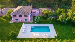 an aerial view of a house with a swimming pool at Doliva Estate in Laganas