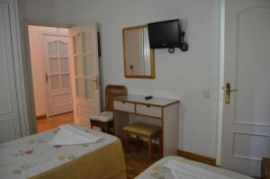 Postel nebo postele na pokoji v ubytování Hostal Triana