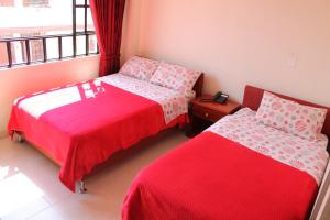 Postel nebo postele na pokoji v ubytování Hotel Vigua