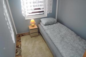Кровать или кровати в номере holiday home, Stepniczka