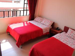Postel nebo postele na pokoji v ubytování Hotel Vigua