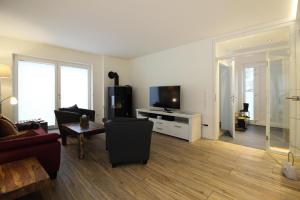 Uma TV ou centro de entretenimento em Semi-detached house, St Peter-Ording