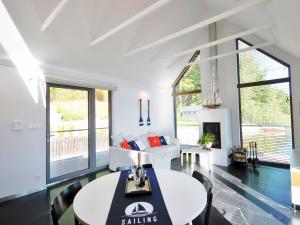 a living room with a couch and a table at Holiday Home in Bytów by Private Lake in Bytów +25 photos