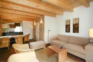 a living room with a couch and a table at Holiday resort, Greetsiel in Greetsiel