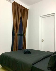 Katil atau katil-katil dalam bilik di Cozy Mayfair Homestay