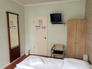 Postel nebo postele na pokoji v ubytování Puschkin Rooms