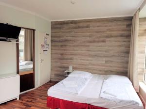 Postel nebo postele na pokoji v ubytování Puschkin Rooms