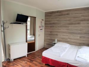 Postel nebo postele na pokoji v ubytování Puschkin Rooms