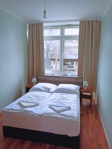 Postel nebo postele na pokoji v ubytování Puschkin Rooms