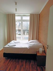 Postel nebo postele na pokoji v ubytování Puschkin Rooms