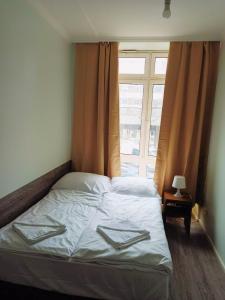 Postel nebo postele na pokoji v ubytování Puschkin Rooms