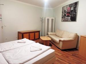 Postel nebo postele na pokoji v ubytování Puschkin Rooms