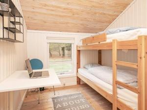 Postel nebo postele na pokoji v ubytování Holiday home Jerup XLVIII