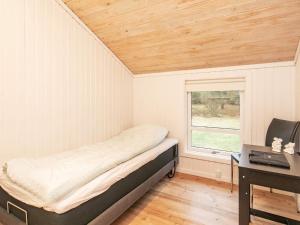 Postel nebo postele na pokoji v ubytování Holiday home Jerup XLVIII