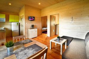 a room with a kitchen and a living room at Holiday resort, Jaroslawiec in Jarosławiec