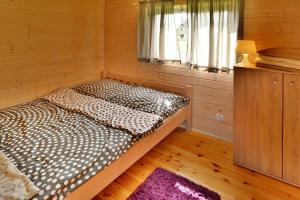 A bed or beds in a room at Holiday resort, Jaroslawiec