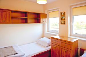 Кровать или кровати в номере Half of holiday home, terrace, playground