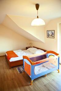 a bedroom with two bunk beds in a attic at Semi-detached houses, Rowy in Rowy