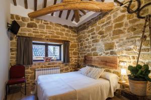 A bed or beds in a room at El Sitio de Carmelo