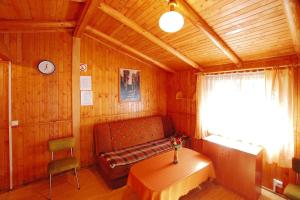 a room with a bench and a table in a cabin at Holiday house near the sea swimming pool Mielno in Mielno