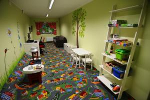 a room with a toy train rug on the floor at Tehvandi Hotell in Otepää